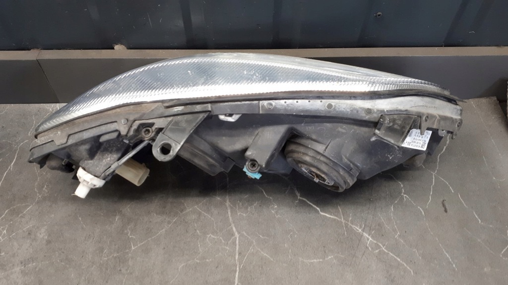 90520877 Lewy προβολέας Opel Astra II G Hella Product image